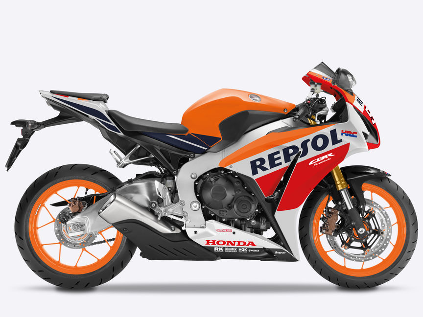 Honda CBR1000RR Fireblade - studyjne zdjęcie przedstawiające trójkolorowy motocykl z profilu