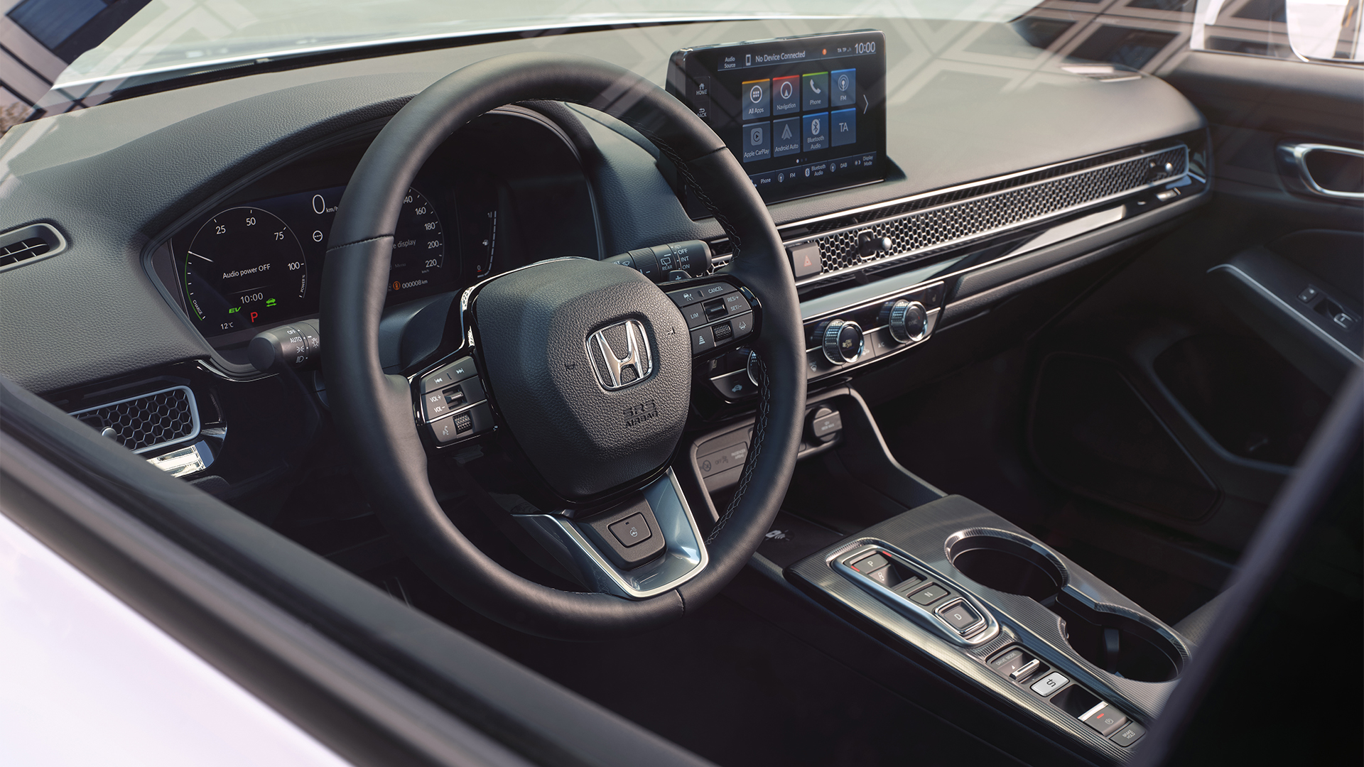Honda Civic Hybrid - widok wnętrza pod kątem, skupiający się na kierownicy.