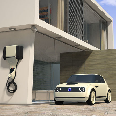 Widok Hondy Urban EV Concept przy punkcie ładowania.