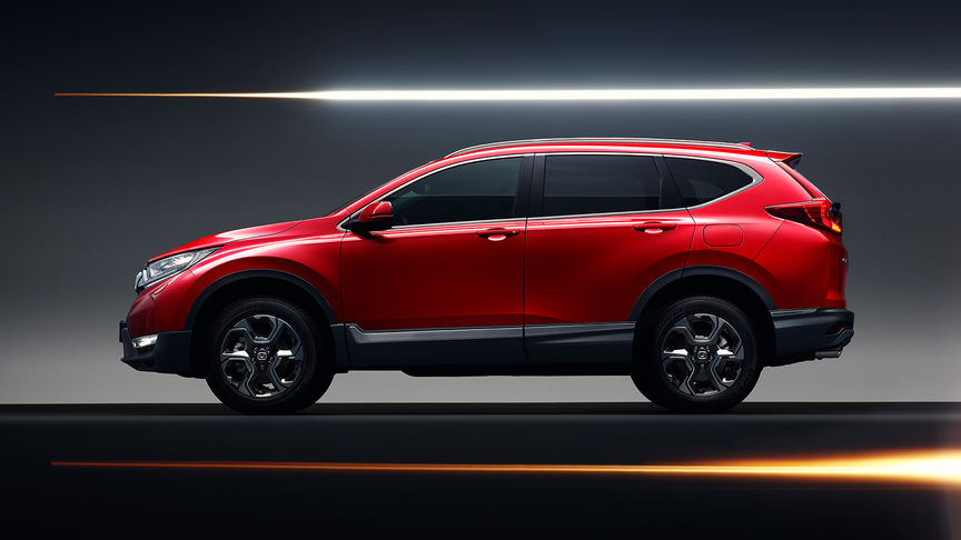 Honda CR-V — widok z boku eksponujący sportową sylwetkę i aluminiowe obręcze kół.