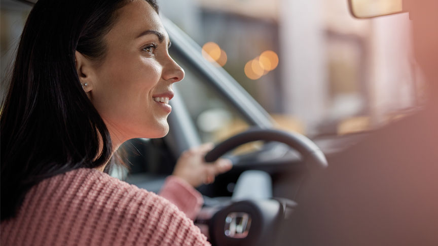 Close up of Women driving Honda Jazz