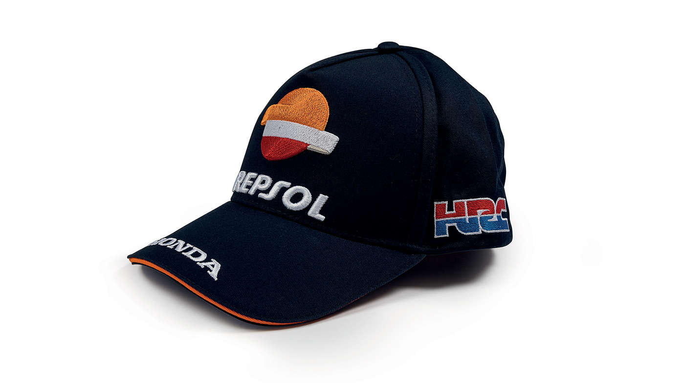 Niebieska czapka z daszkiem w barwach zespołu Honda MotoGP z logo Repsol.